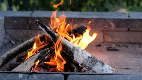 There is a small fire of small wood for shish kebabs in a brick barbecue house Stock Footage 127931847