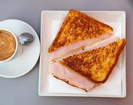 There is thin slice of soft and juicy ham between two slices of bread. Foto stock