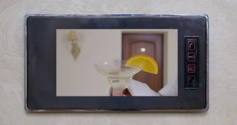 There is a video on the intercom screen where person in terry dressing gown, who Stock Footage 170336360