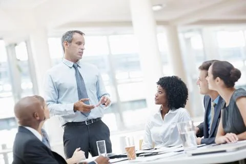 Theres a few changes Id like to implement. A multi-ethnic group of business Foto stock