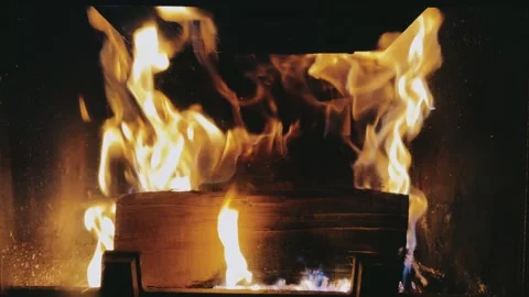 There's a fire burning in the old fireplace. Stock Footage 254607139