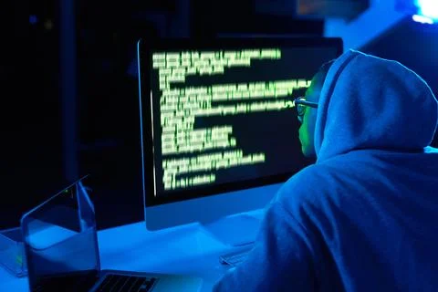 Theres a hack to everything in life. a young male hacker cracking a computer Stock Photos