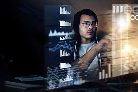 Theres no code he cant crack. Shot of a young hacker cracking a computer code Stock Photos