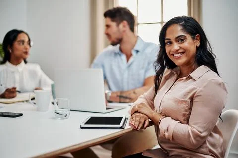 Theres no task we cant accomplish as a team. a young businesswoman using a Stock Photos