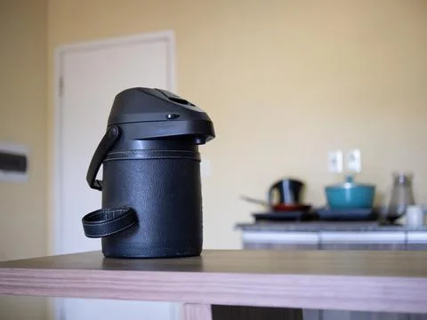Thermal beverage container on kitchen table indoors Stock Photos