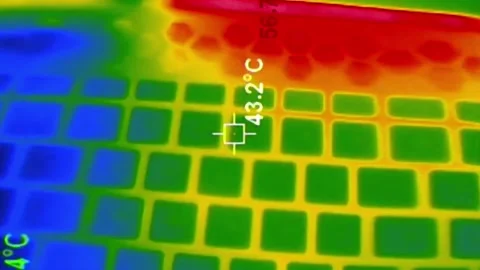 Thermal camera view of an overheating laptop keyboard with temperature scale. Video stock 314547687