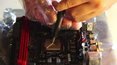 Thermal Compound being installed on Brand new high end Intel CPU to conduct heat Stock-Footage 158735854