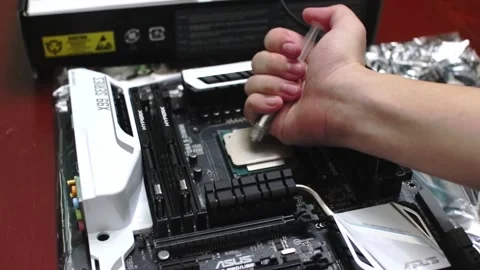 Thermal Compound being installed on Brand new high end Intel CPU to conduct heat Stock-Footage 158753475