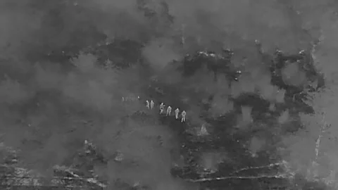 Thermal drone camera reveals illegal entry of migrants at the US border. Video stock 280468327