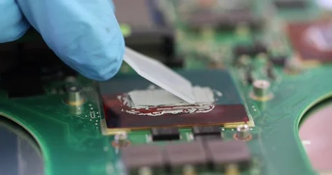 Thermal grease on computer or laptop processor chip Stock Footage 235926398
