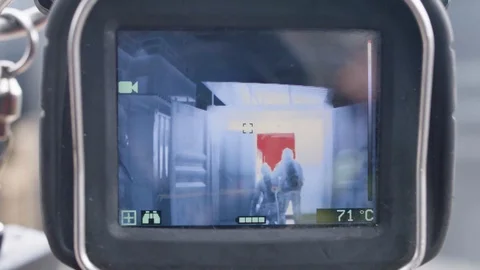 Thermal image of fire crew in front of fire Stock Footage 91036684