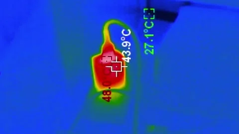 Thermal Imaging of a Hot Power Adapter Plugged into an Outlet Video stock 314547641