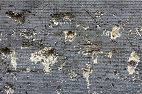 Thermal insulation on the wall with square gray texture and white foam notche Фото