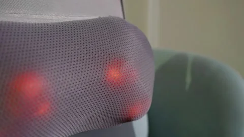 The thermal massager creates comfortable vibrations, relaxing the neck muscles.  Stock Footage 301312066