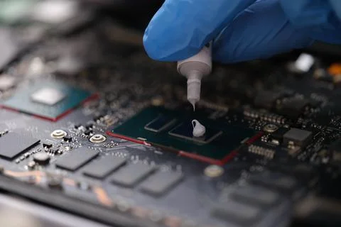 Thermal paste on computer processor chip closeup 스톡 사진
