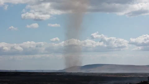 Thermal Smoke Vortex Spinning Above Charred Ground in Wales, Wide Shot Stock-Footage 343402655