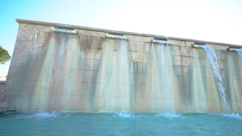 Thermal spa resort under the open air, high marble wall with waterfall being Stock-Footage 264770149