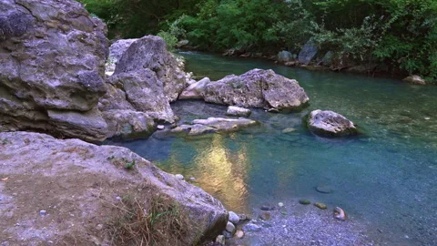 The thermal springs of Lu Vurghe flow near Acquasanta Terme on the Tronto river Stock Footage 268886053