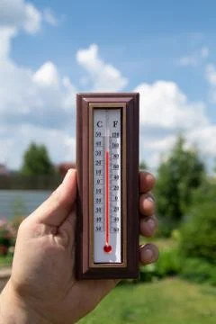 Thermometer against the sky Stock-Fotos