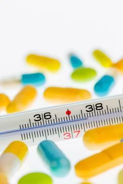 Thermometer and tablets 스톡 사진