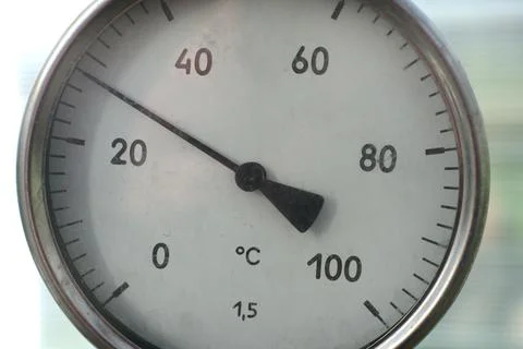 The thermometer with an arrow for measuring the temperature is round. Stock Photos