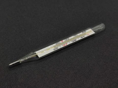 Thermometer on a black background Stock Photos