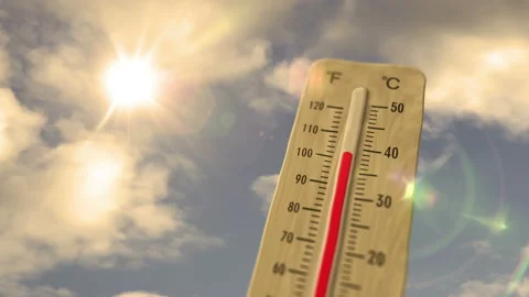 Thermometer on blue sky and shining sun Stock Footage 201402350