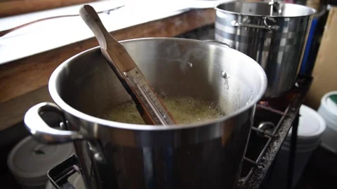 Thermometer in boiling maple syrup for cooking Stock Footage 167173115