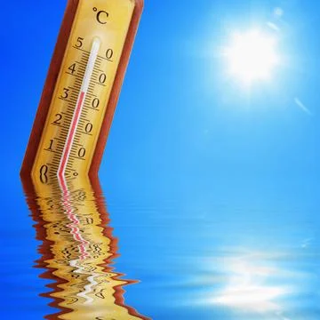 Thermometer with celsius scale showing extreme high temperature. Stock Photos