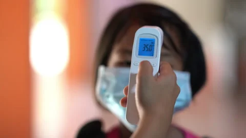 Thermometer checking temperature of body of children before to classroom Stock Footage 166098116