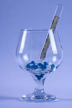 Thermometer in a glass Stock Photos