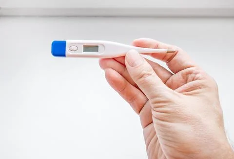 Thermometer in the Hand Stock Photos
