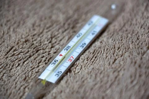 A thermometer in the hands Stock Photos