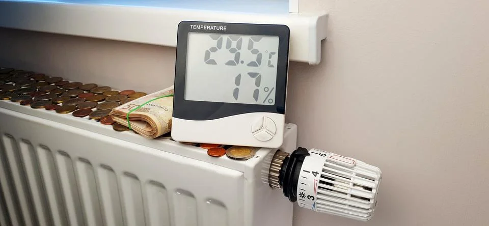 The thermometer that indicates the high temperature is located on the radiator Stock Photos