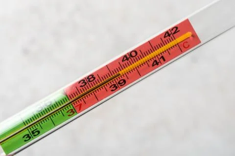 Thermometer on light background. High temperature 38,3. Top view Stock Photos