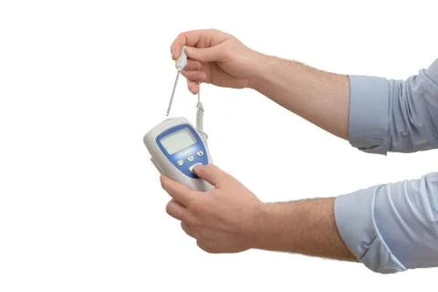 Thermometer with lockable probe in hands Stock Photos