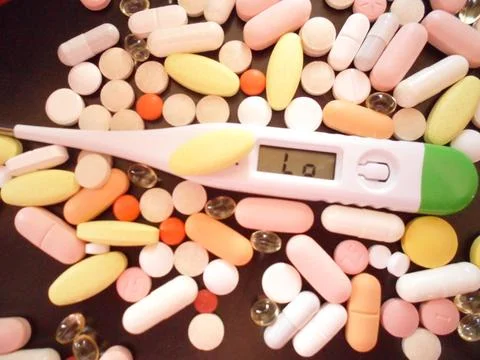 Thermometer for measuring temperature during colds or inflammation in the body. Stock Photos