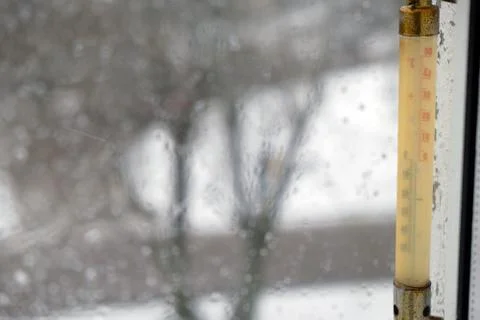 Thermometer outside the window in the winter Stock Photos