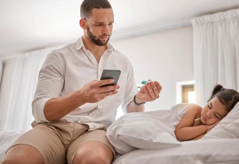 Thermometer, phone and father with a sick child in the bedroom sleeping and Stock Photos