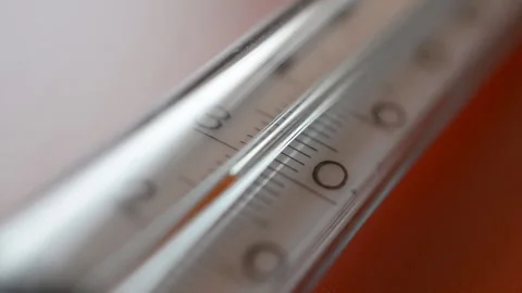 Thermometer on a red background Stock Footage 115803020