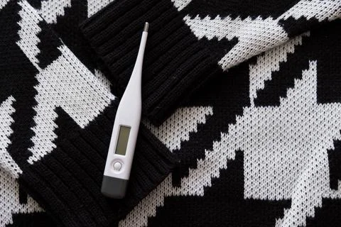 Thermometer on a scarf. Stock Photos