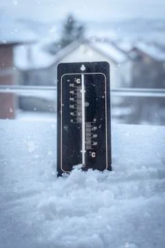 Thermometer set in the snow Stock Photos