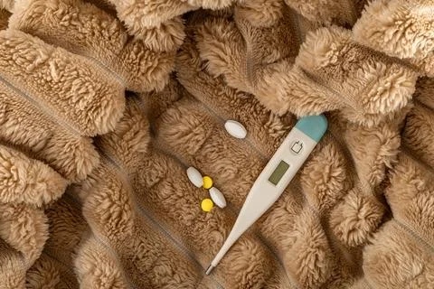 A thermometer showing a high temperature of a sick patient, a flu epidemic,.. Stock Photos