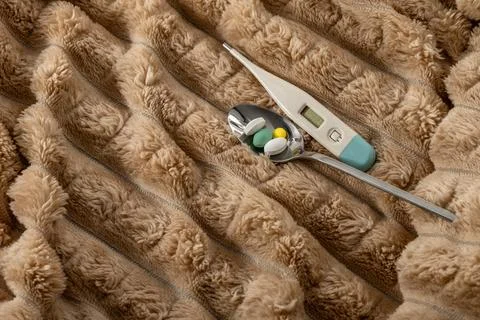 A thermometer showing a high temperature of a sick patient, a flu epidemic,.. Stock Photos