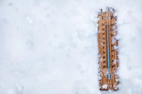 Thermometer in the snow Stock Photos