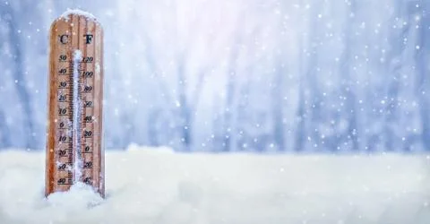 Thermometer on snow Stock Photos