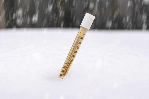 Thermometer in the snow Stock Photos