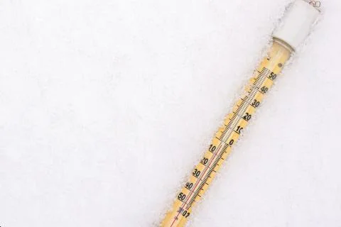Thermometer in the snow Stock Photos