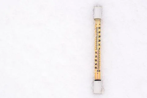 Thermometer in the snow Stock Photos