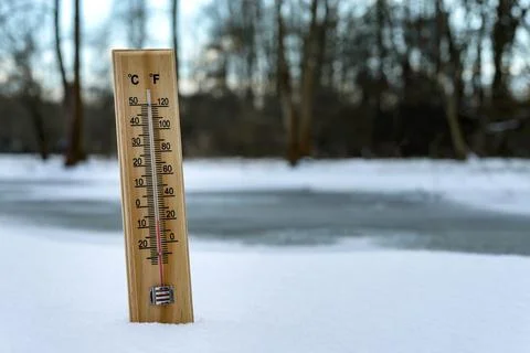 Thermometer on snow Stock Photos